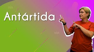 "Antártida" escrito em fundo colorido ao lado da imagem da professora apontado para a palavra